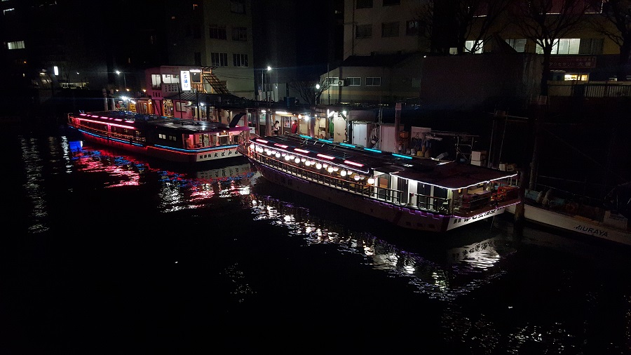 Yakatabune pleasure boats and their bobbing lights docked off the Sumida River