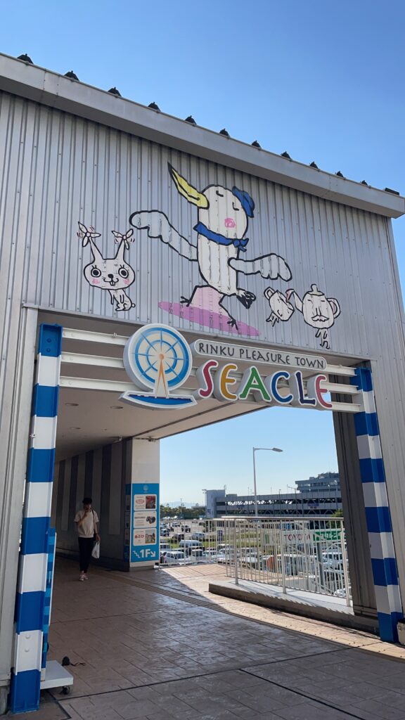  Entrance to Rinku Pleasure Town Seacle, featuring a colorful cartoon mural. Title: Entrance to Rinku Pleasure Town Seacle 