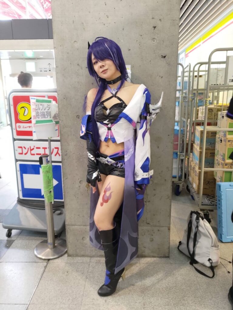 Cosplayer posing in intricate costume at Tokyo Game Show 2024.