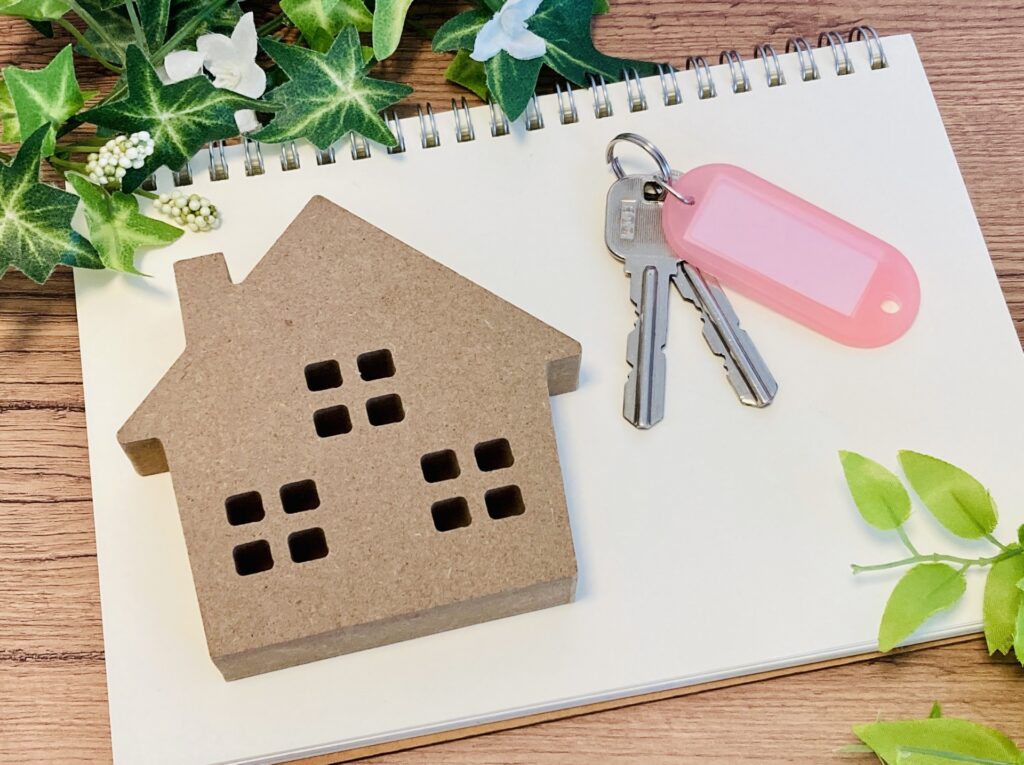 Close-up of hands exchanging house keys, symbolizing a real estate transaction for Key Money.