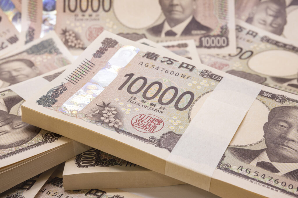  Stack of Japanese yen 10,000 bills, symbolizing currency and financial transactions for Key Money.