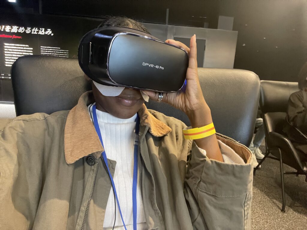 A visitor using a VR headset for an immersive experience at the Asahi Beer Museum.