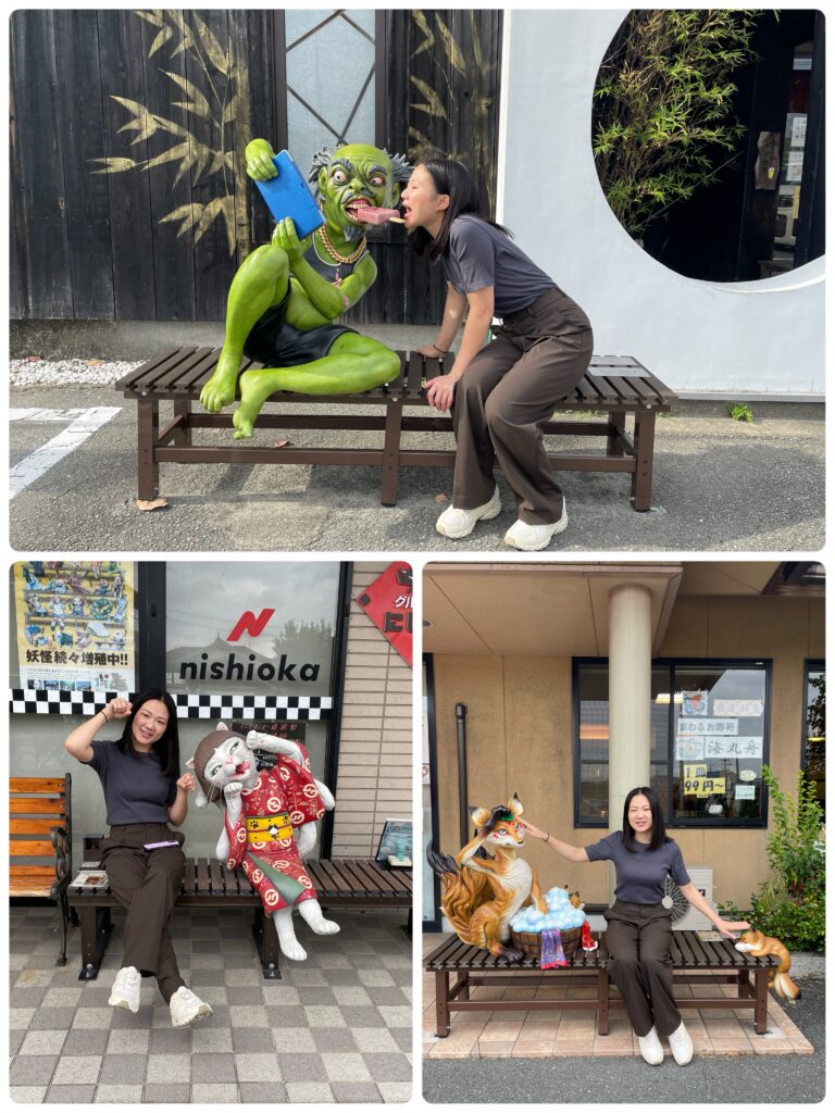 A woman interacting with different demon statues on benches, each with humorous or playful poses.