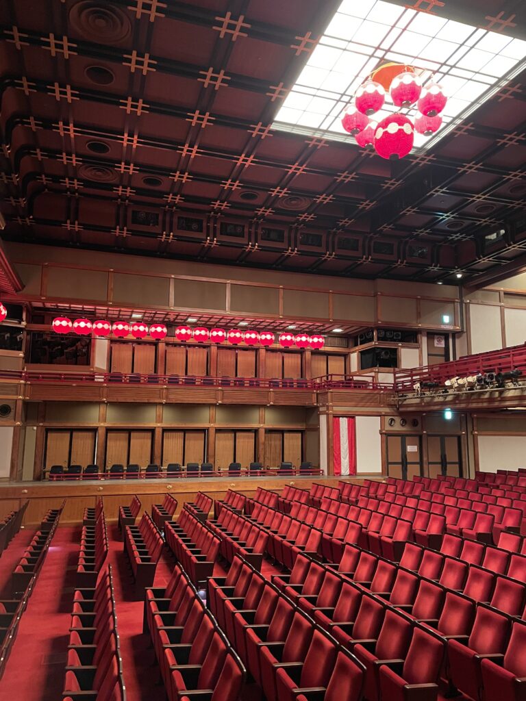 Elegant red-seated theater inside the Kyoto Geisha Museum.