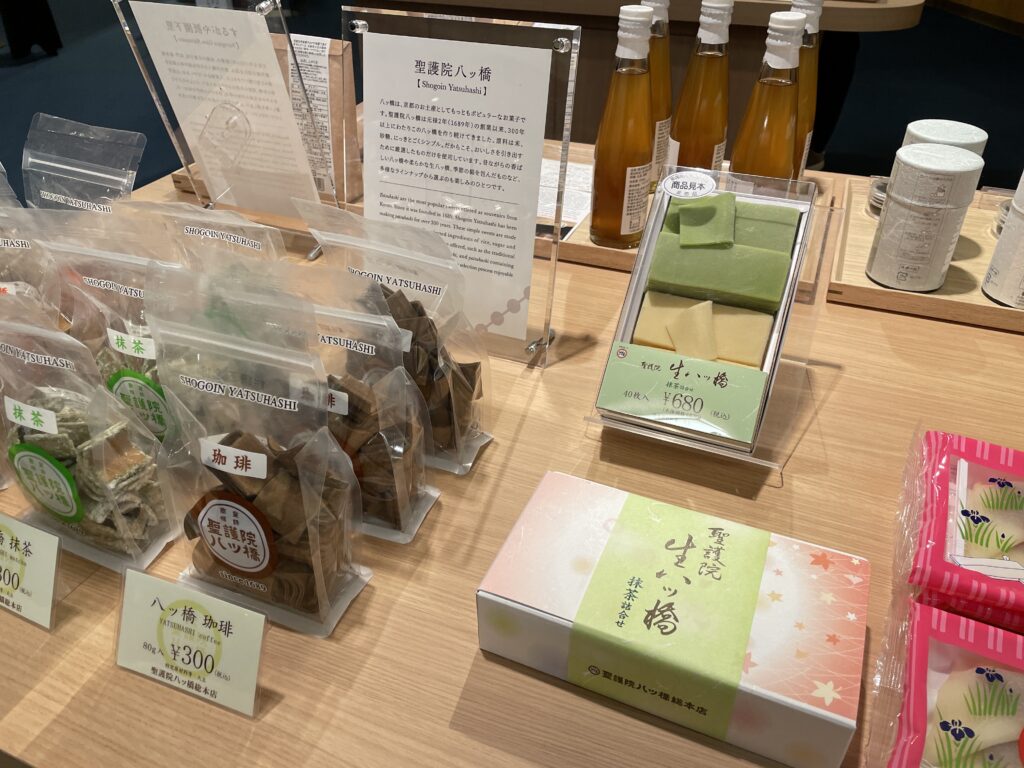 Kyoto souvenirs on display, including matcha yatsuhashi and Japanese sweets.