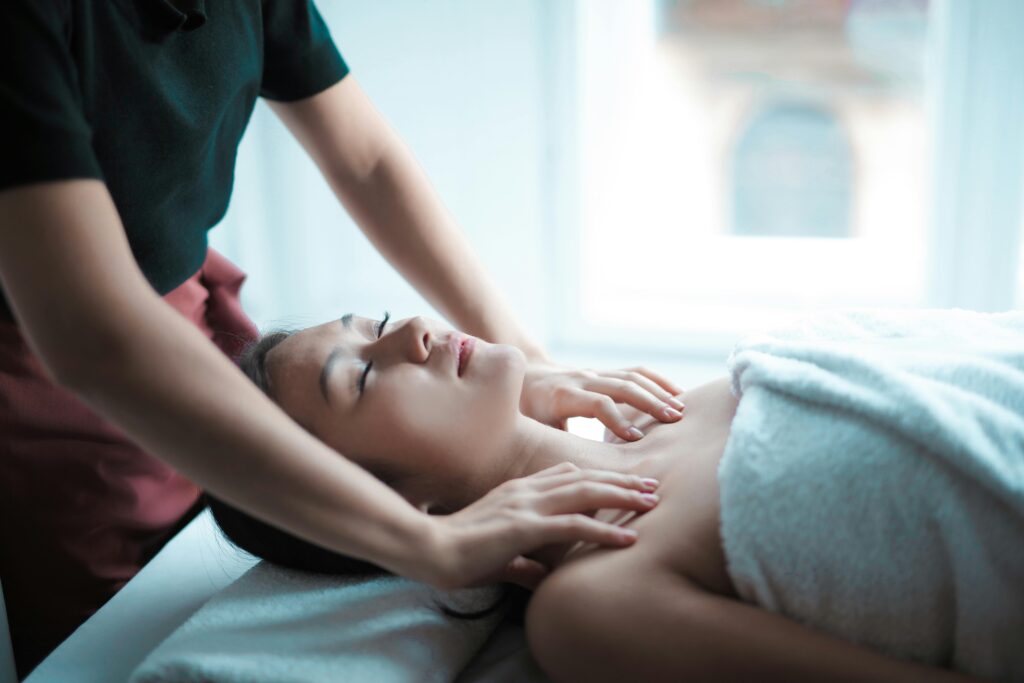 A woman enjoying a relaxing shoulder massage at a spa.