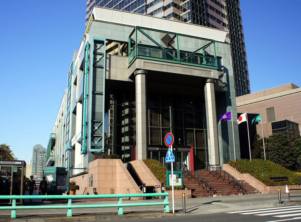 The entrance to the Tokyo Metropolitan Museum of Photography, a modern building with large columns and glass panels.