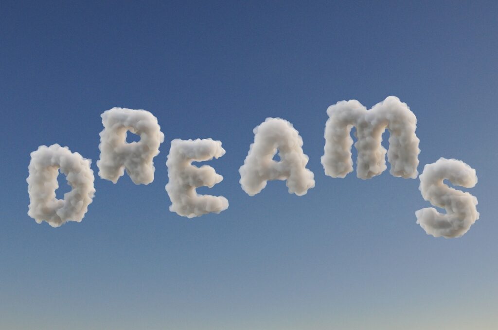  The word "DREAMS" spelled out in fluffy white clouds against a bright blue sky. Sleep Apnea