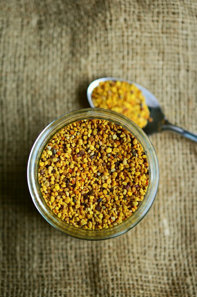 Glass jar of bee pollen, a nourishing ingredient for DIY hair masks.