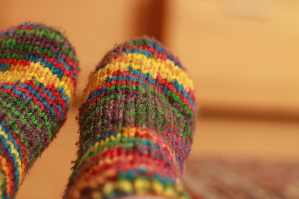 Knitted rainbow socks representing the S.Labo create-your-own-socks workshop in Osaka
