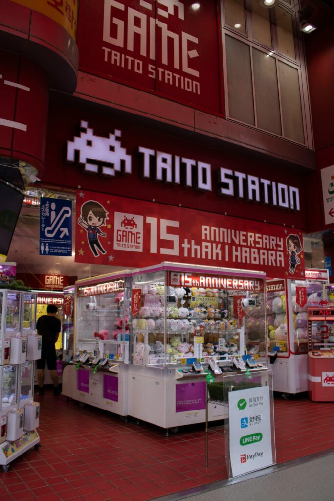 Inside view of Taito Station Akihabara with claw machines and plush toys