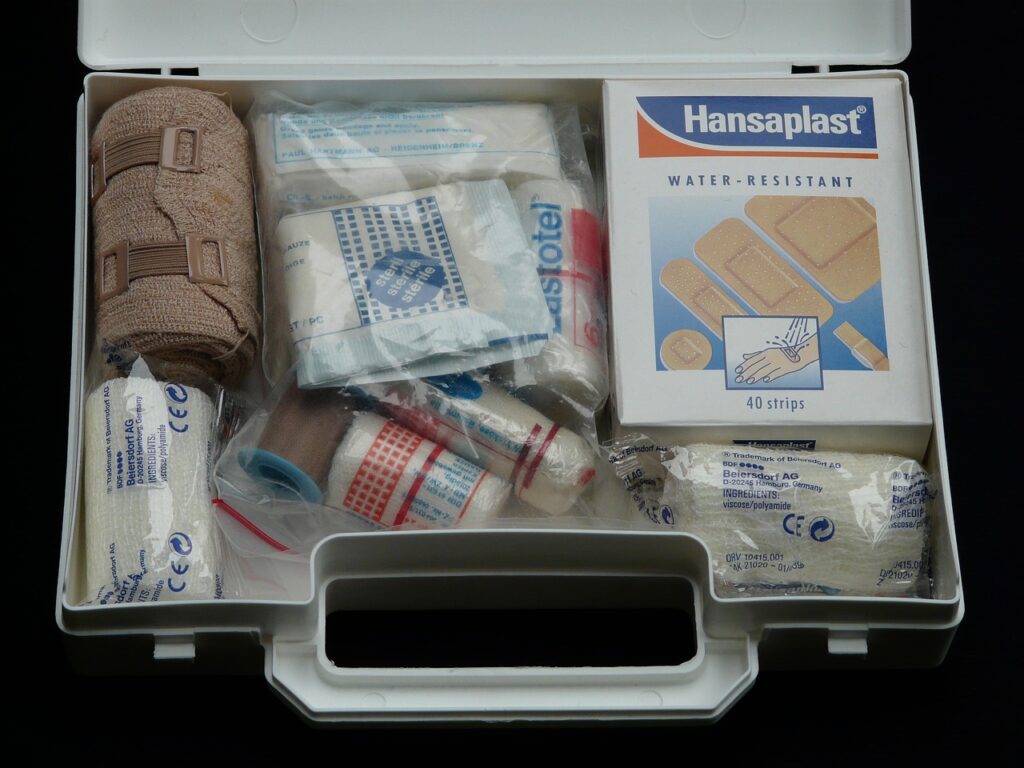 Open first-aid kit with bandages and medical supplies