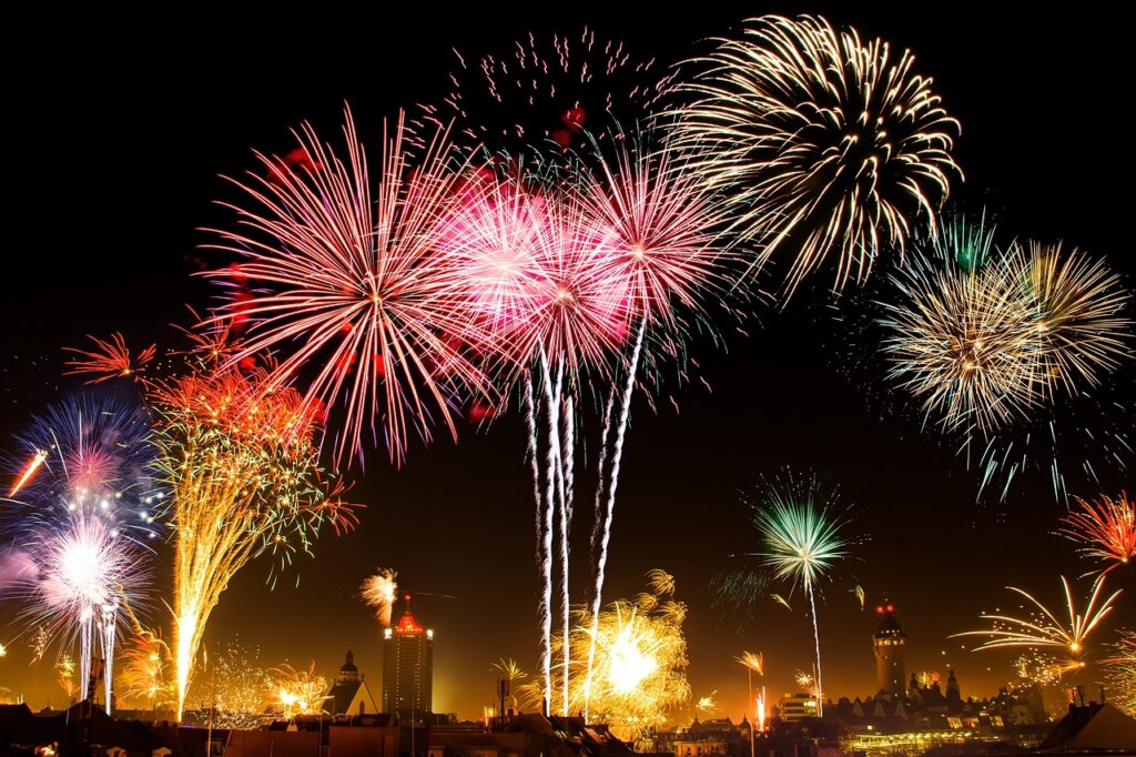 Fireworks lighting up the night during Tenjin Matsuri, one of Osaka Summer Festivals