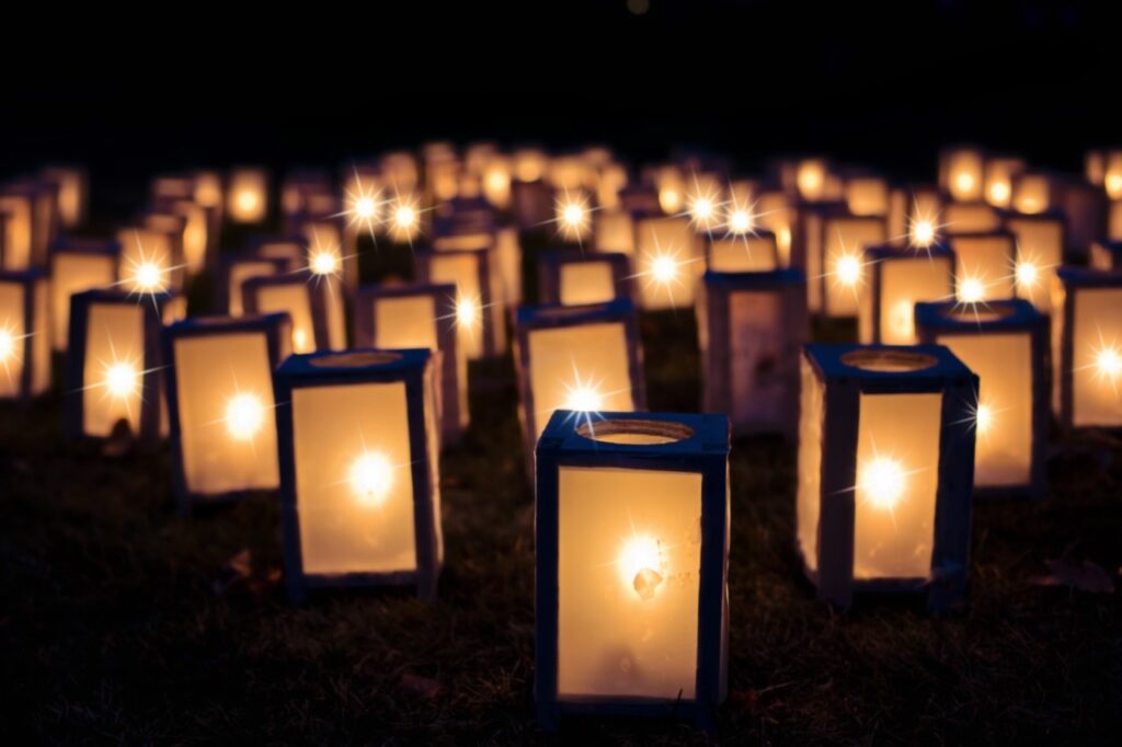 Dozens of lanterns glowing together during Candle Night, part of Osaka Summer Festivals