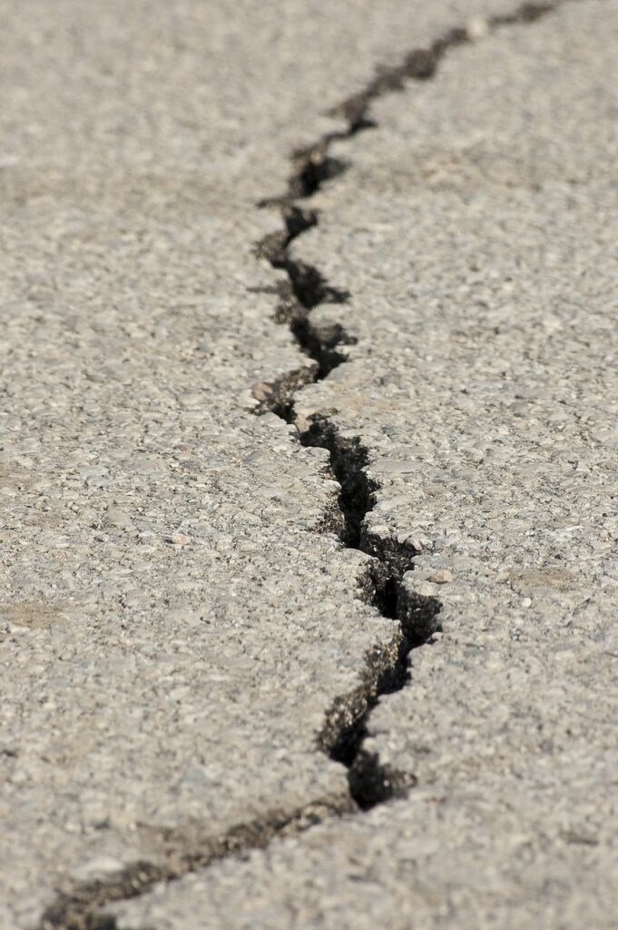 Crack in a concrete road surface after an earthquake.