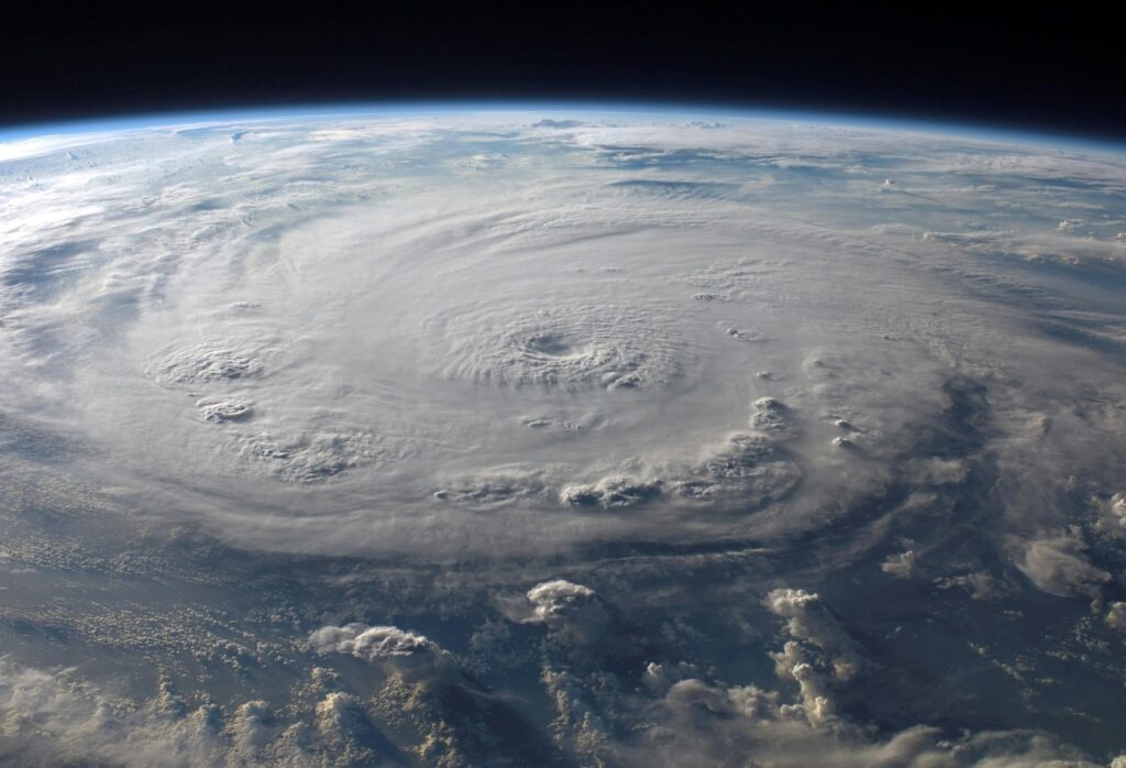 Satellite view of a massive spinning typhoon over the Earth.