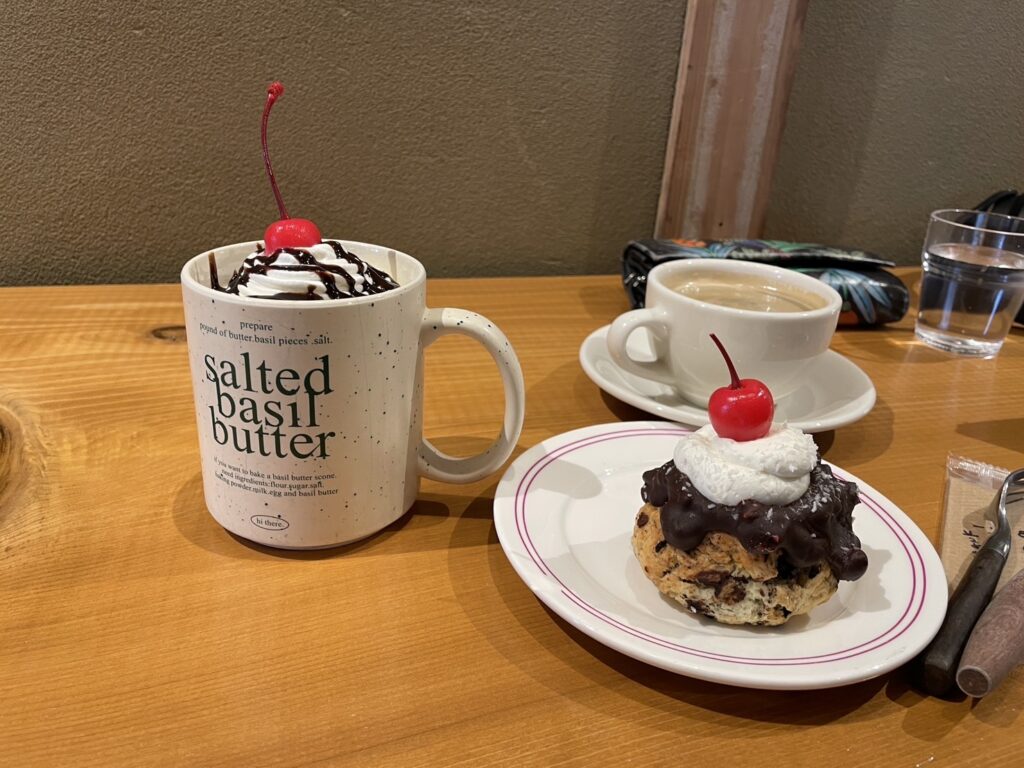 Ham and cheese croissant, pain au chocolat, and iced coffee served at PATHFINDER café in Nakazakicho