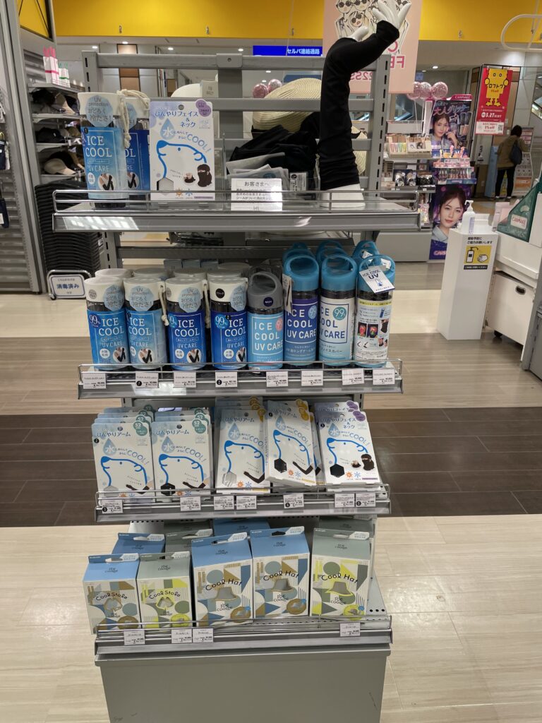 Tokyo shop display offering cooling products like fans, cooling sprays, and UV protection for summer heat.