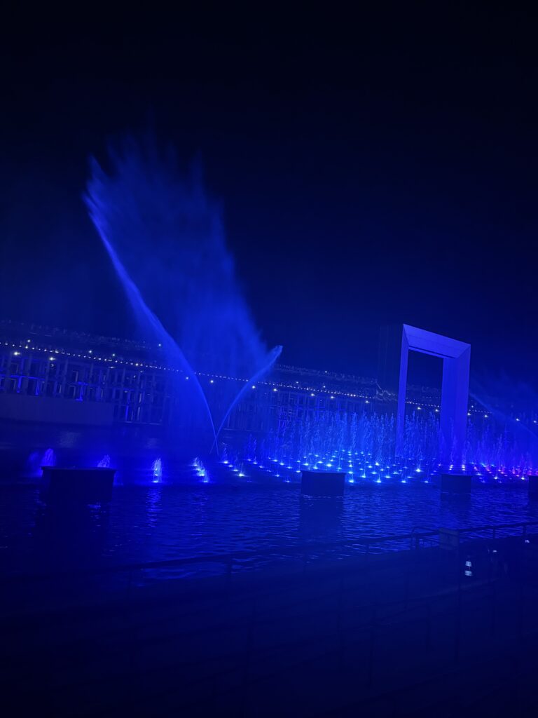 Blue illuminated water fountain show at Osaka Expo 2025