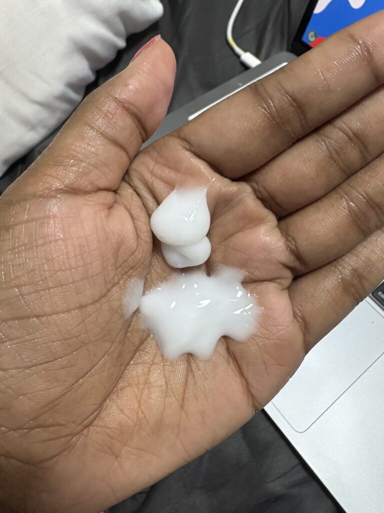 Open jar of Momori Styling Jelly showing light pink texture