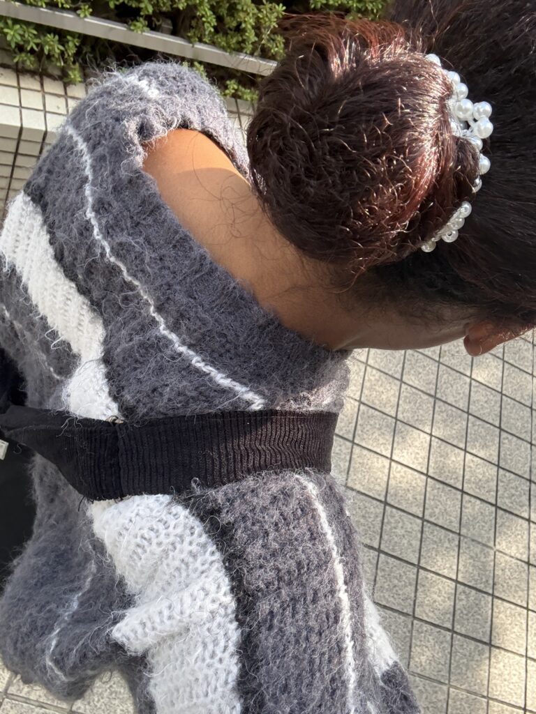 Braided hairstyle preparation with natural curly hair.