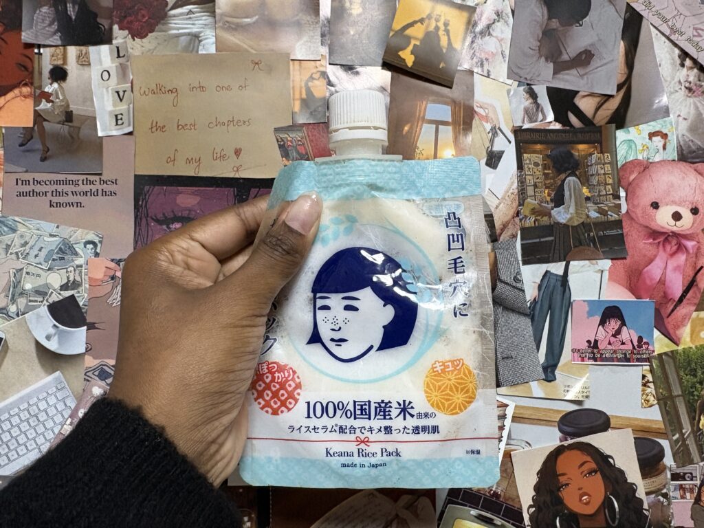 Minimalist skincare setup with glass beaker, serum applicator, and dried florals