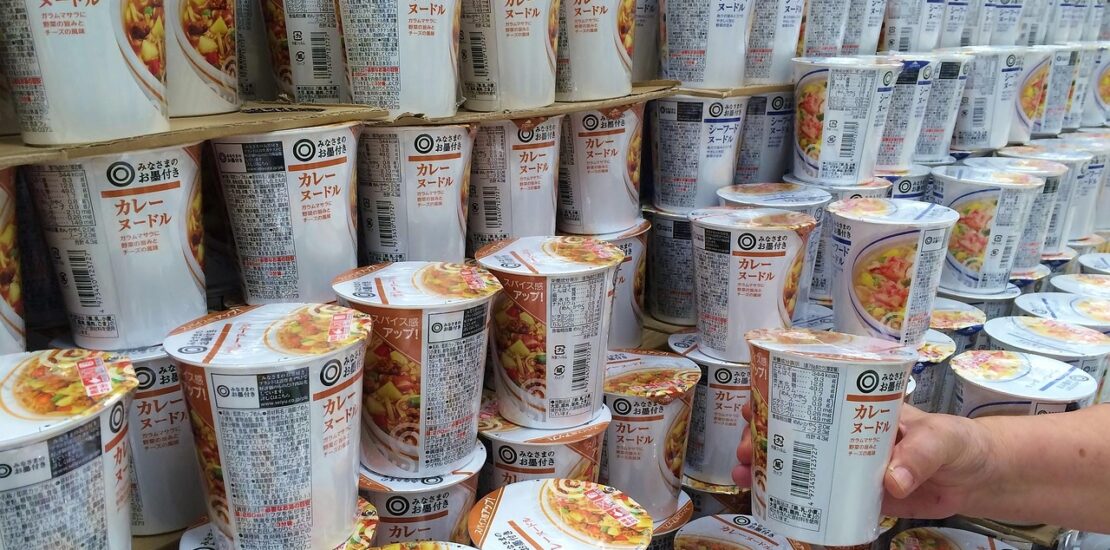 Stacks of Japanese cup noodles displayed in a store aisle