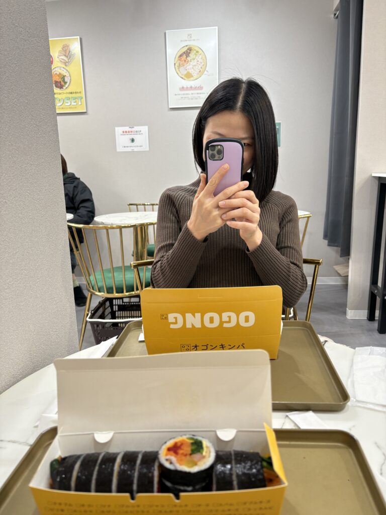 Gimbap meal from OGONG in Osaka Koreatown with woman taking a mirror selfie
