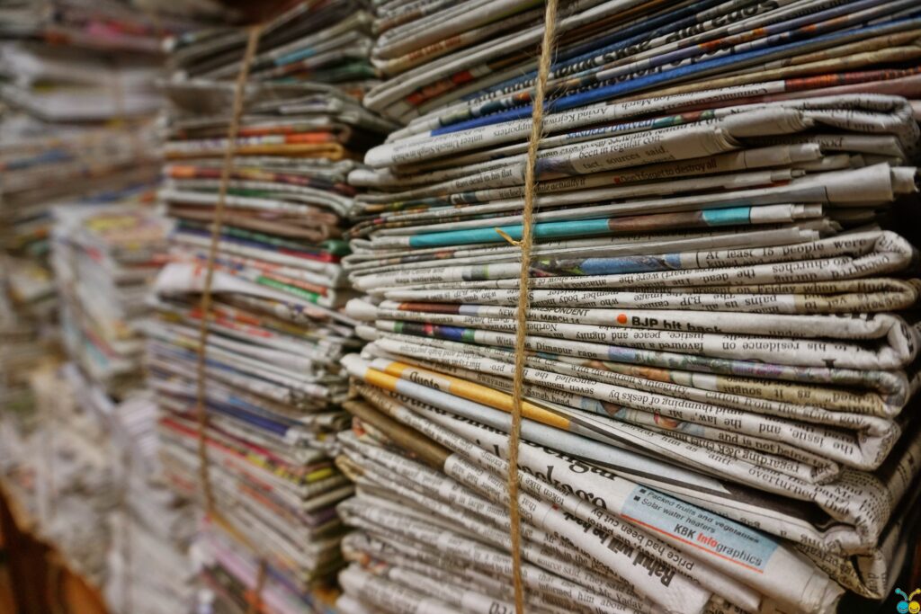 Stacks of bundled newspapers prepared for paper recycling collection