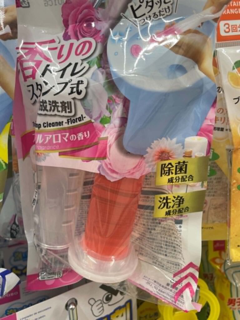 Daiso floral toilet cleaner stamp with a blue applicator and pink cleaning gel refill.