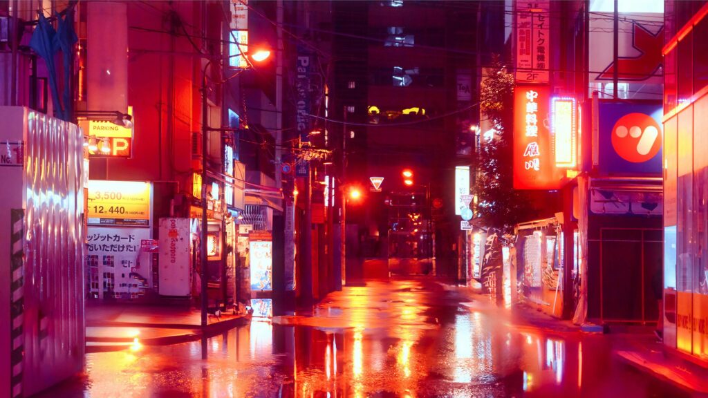 Quiet neon-lit alley in Tokyo after rainfall with reflections glowing on wet streets during a rainy evening.