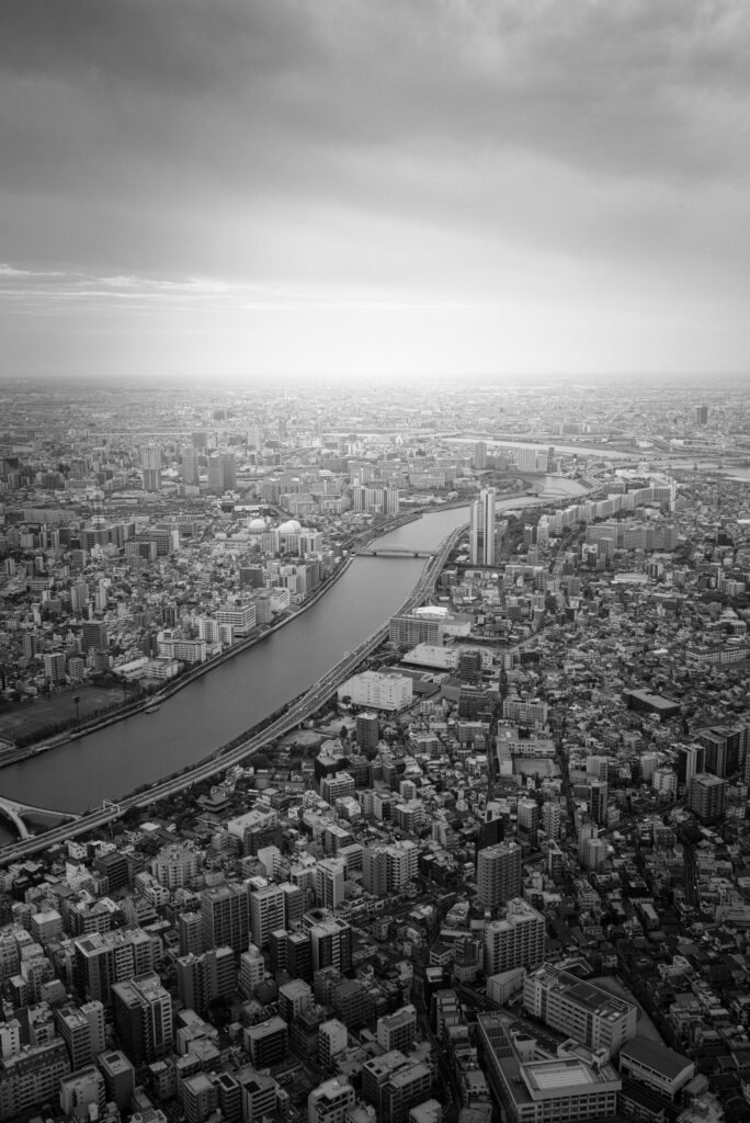 Historic view of the Sumida River area, illustrating Tokyo’s dramatic transformation since the 19th century.