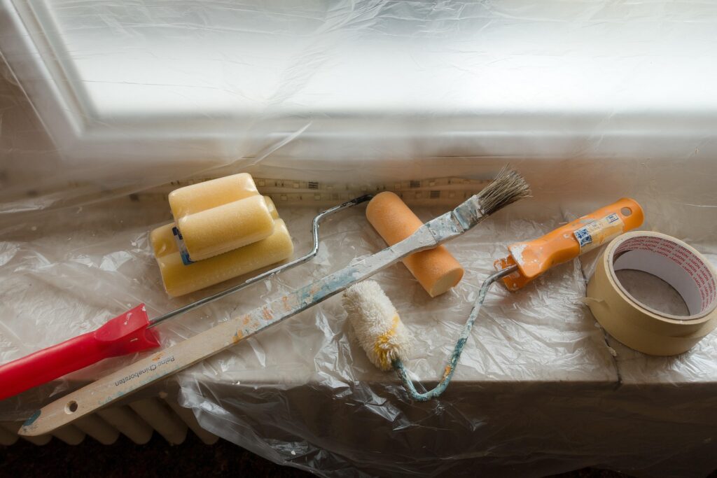 Painting supplies and tools prepared for a renovation project.