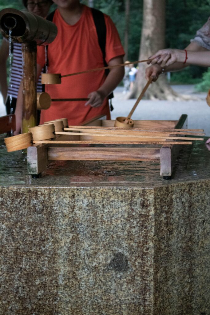 Visitors performing the Shinto hand purification ritual at Yasukuni Jinja.