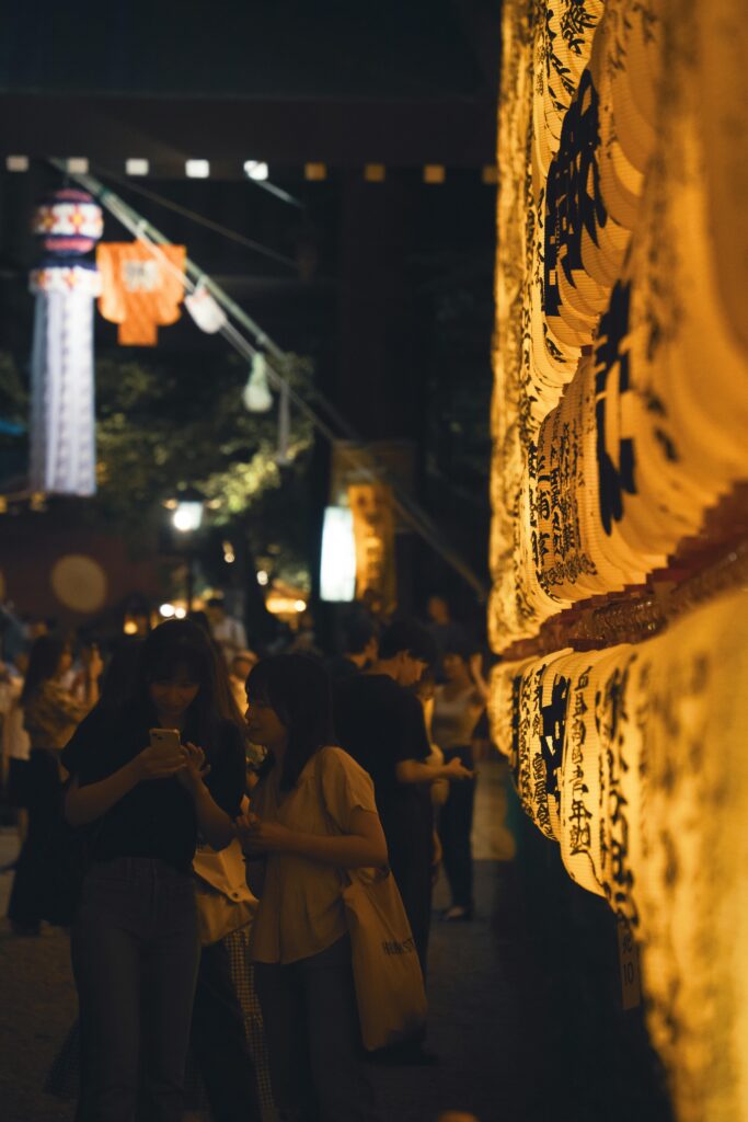 Festival lanterns decorating Yasukuni Jinja during a seasonal celebration.