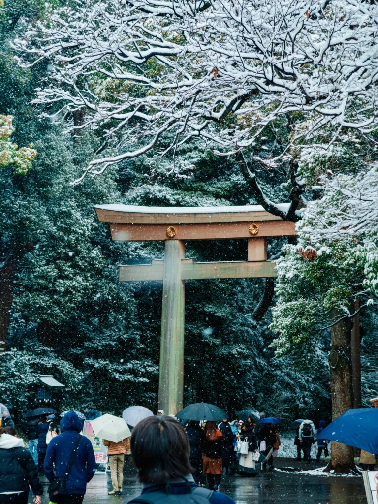 Snow-covered torii gate at Yasukuni Jinja in winter.