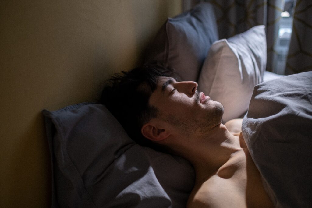 Person sleeping comfortably with the air conditioner running overnight.