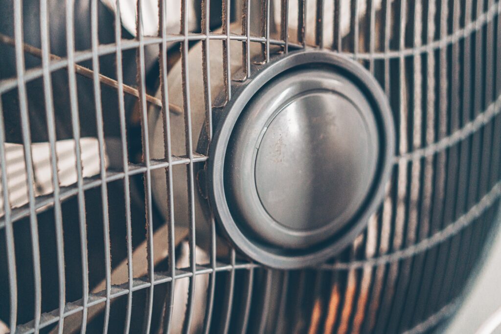 Close-up of an electric fan used to circulate air during hot summer weather.