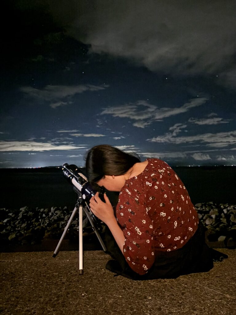 Stargazing with a telescope during a nighttime camping trip in Koganezaki.