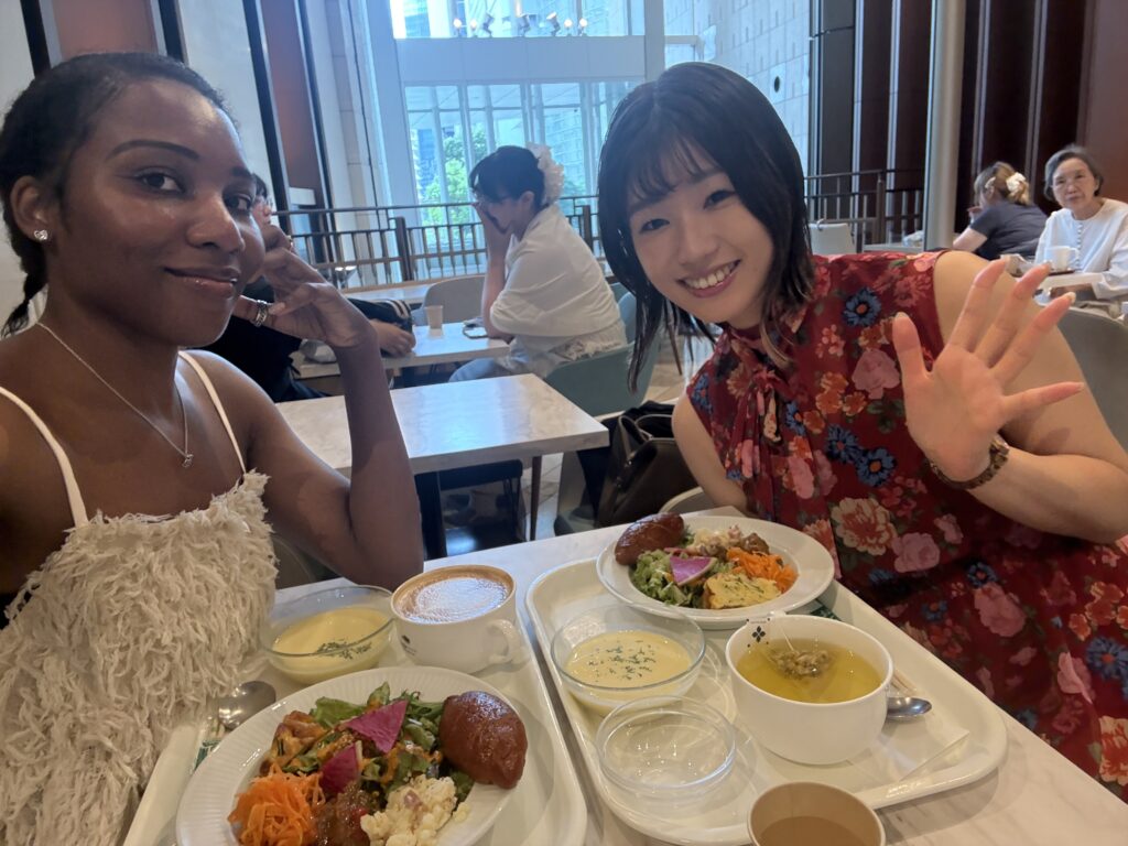 Two friends enjoying lunch together at a restaurant before attending a Shiki Theatre performance in Osaka.