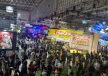 Crowded Tokyo Game Show 2026 exhibition floor featuring the Crazy Taxi World Tour booth at Makuhari Messe.