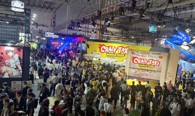 Crowded Tokyo Game Show 2026 exhibition floor featuring the Crazy Taxi World Tour booth at Makuhari Messe.
