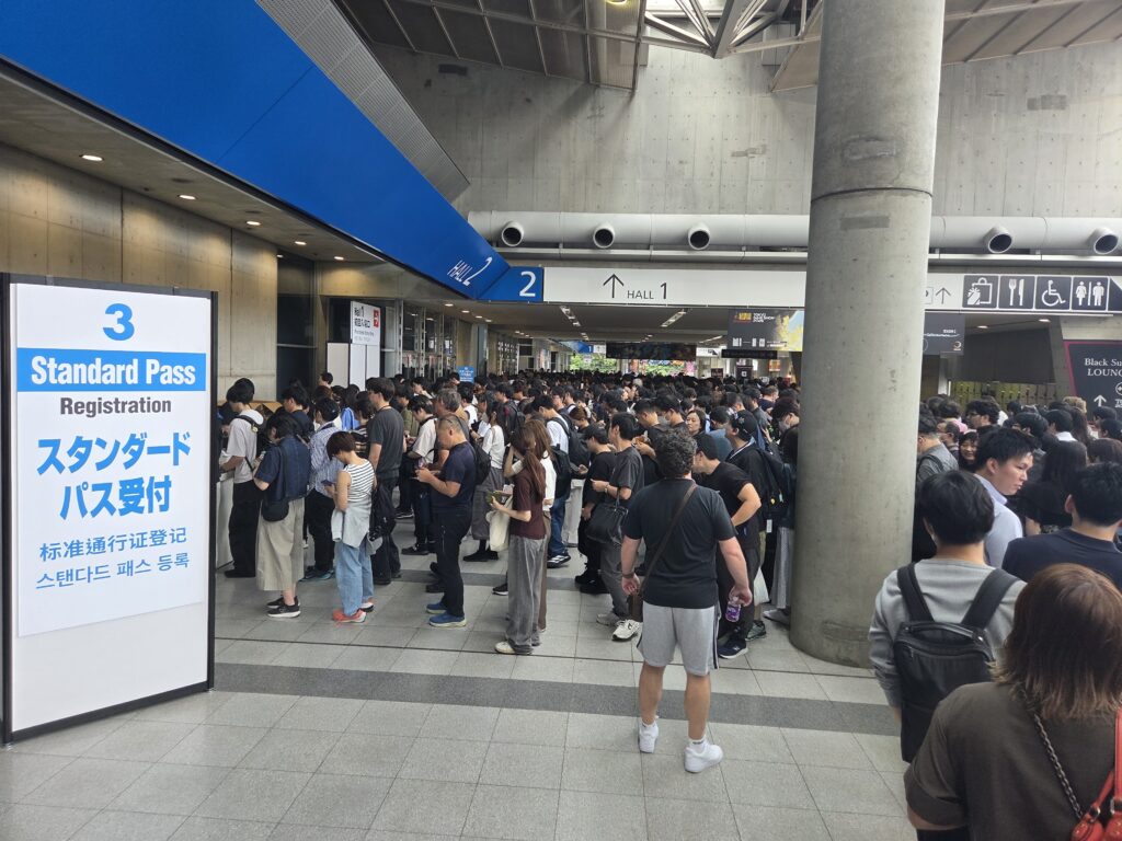 Large crowd waiting at the Standard Pass registration area for Tokyo Game Show 2026.