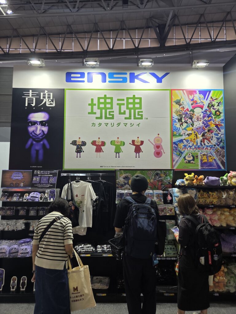Gaming merchandise display featuring Katamari Damacy, Pokémon and other characters at Tokyo Game Show 2026.