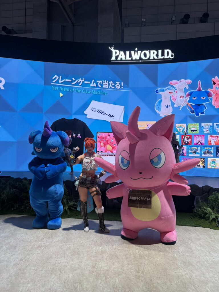 Palworld booth featuring large character mascots and a cosplayer at Tokyo Game Show 2026.