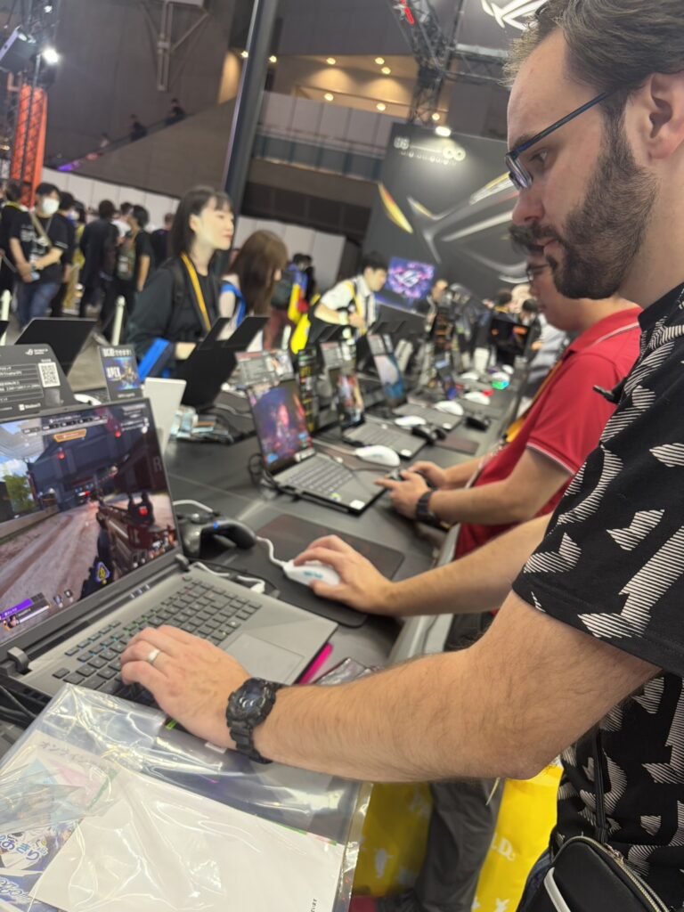 Visitor playing a game on a gaming laptop at Tokyo Game Show 2026.