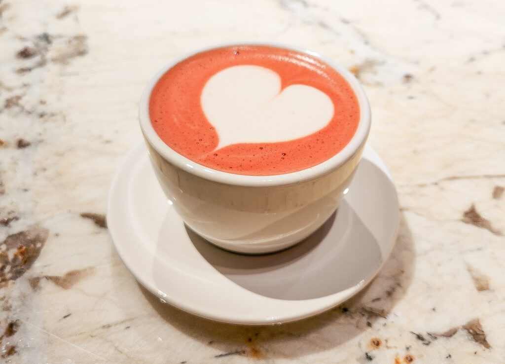 Red Latte with heart-shaped latte art at Sow Coffee Roasters in NEWoMan Takanawa