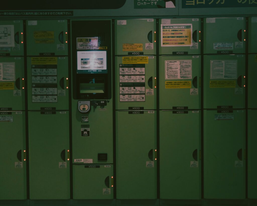 Large coin lockers at a train station in Japan for storing suitcases and other luggage.