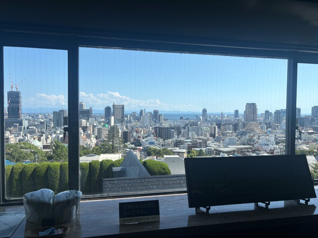 Panoramic view of Kobe’s city skyline and harbor from the Uroko Museum of Art observation gallery at Ijinkan.