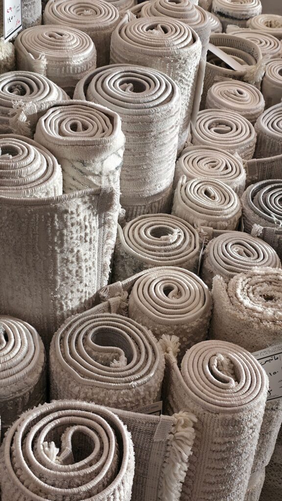Rolled carpets and rugs that can help insulate cold floors and make Japanese apartments warmer in winter.